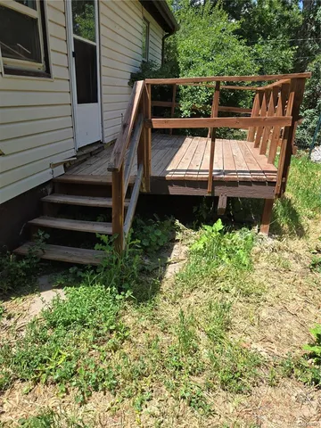 a view of a backyard with sitting area