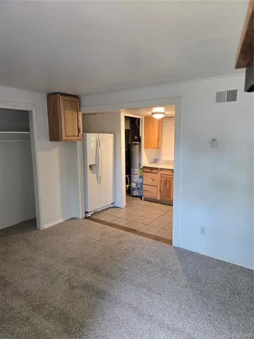 an empty room with window and an empty room