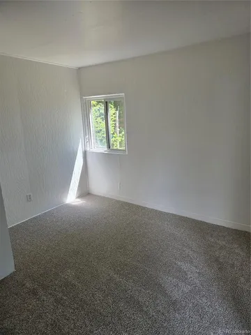 an empty room that has a window
