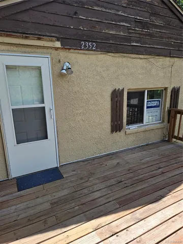 a view of balcony with wooden floor and outdoor space