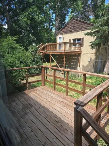a view of a park with large trees