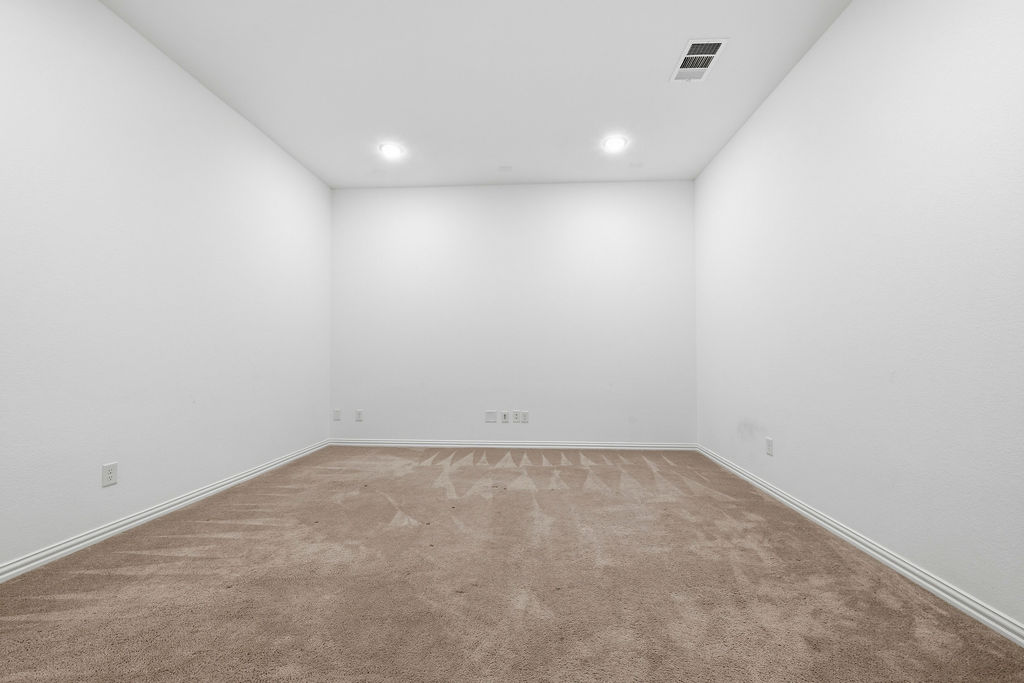 1005 Ridge Runner Drive Georgetown, TX 78628 - Photo 26 of 32 Carpeted room featuring recessed lighting, white walls, and white baseboards