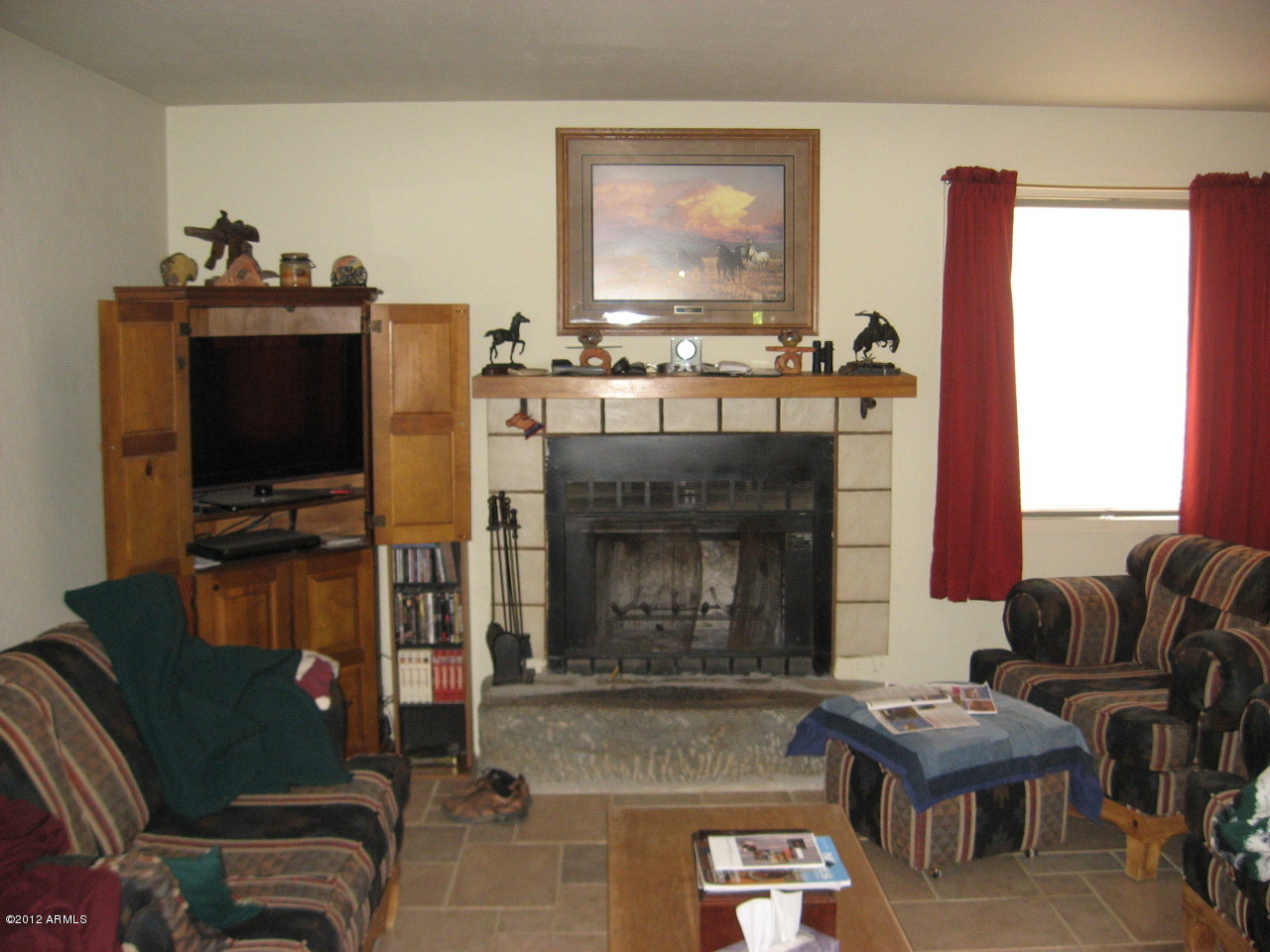 36700 South Rincon Road Wickenburg, AZ 85390 - Photo 13 of 15 Living room with fireplace