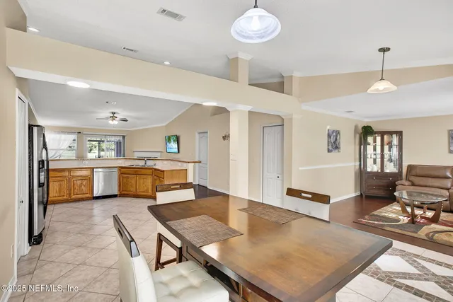 a kitchen with stainless steel appliances a stove a sink refrigerator and microwave