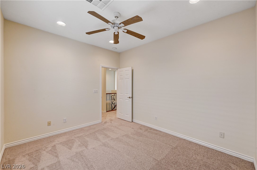 6761 Clay TABLET Street Las Vegas, NV 89149 - Photo 56 of 73 Plush carpeting anchors this versatile room boasting recessed lighting and warm neutral walls.