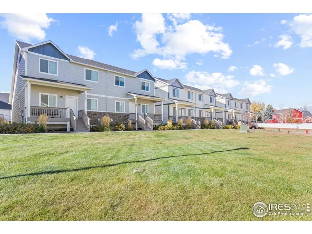 a view of an apartment with a garden