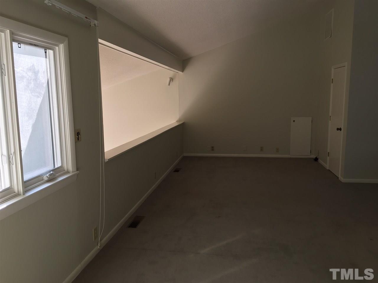 5401 Edington Lane Raleigh, NC 27604 - Photo 13 of 25 an empty room with a window