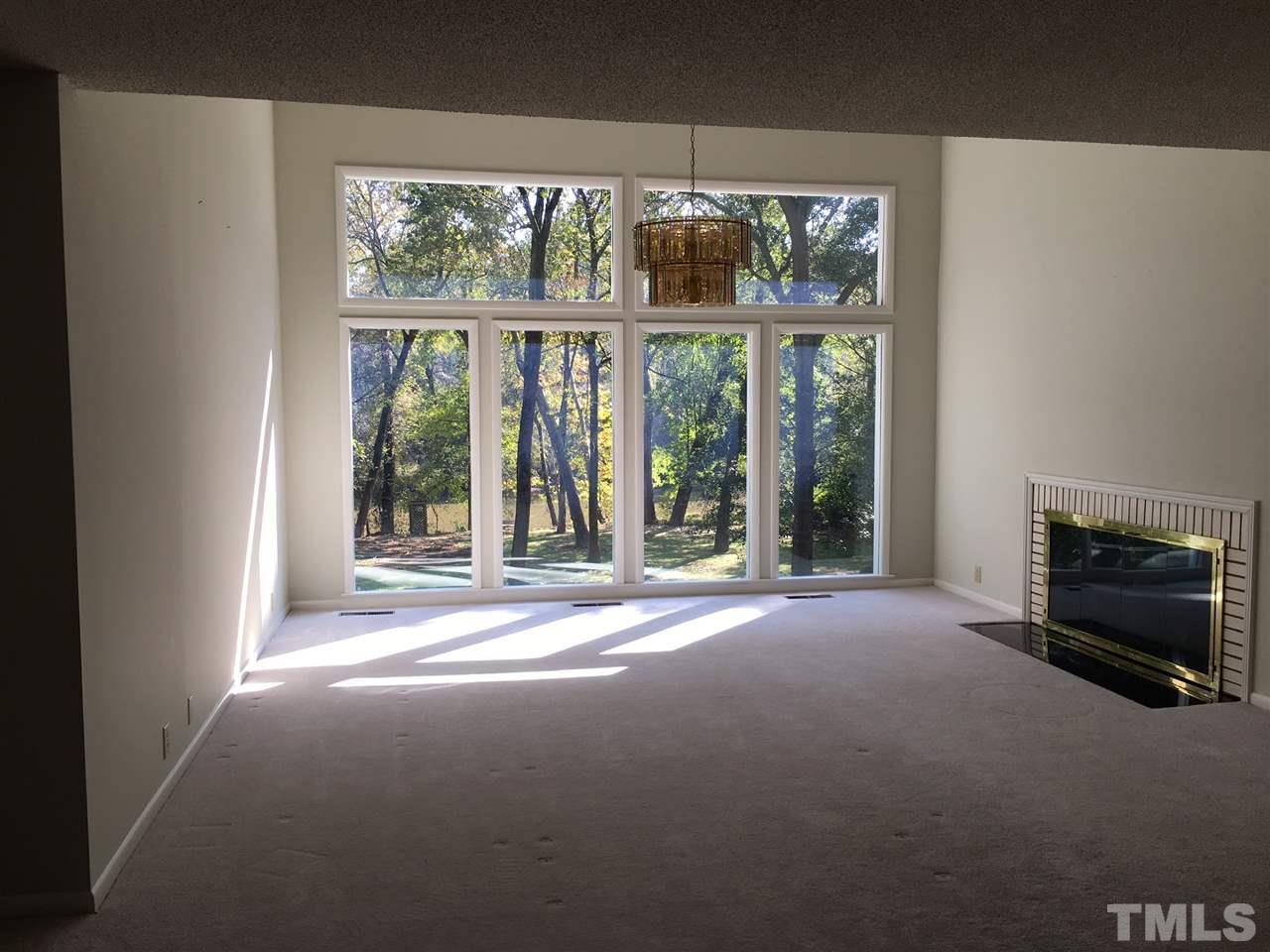 5401 Edington Lane Raleigh, NC 27604 - Photo 5 of 25 a view of a fireplace and window in an empty room