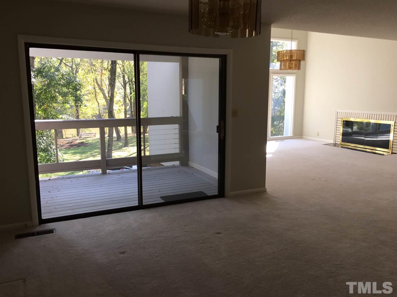 5401 Edington Lane Raleigh, NC 27604 - Photo 6 of 25 a view of empty room with floor to ceiling window