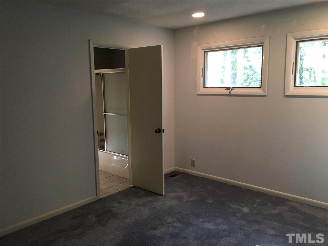 5401 Edington Lane Raleigh, NC 27604 - Photo 9 of 25 an empty room with windows and closet