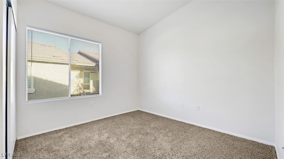 2305 West Horizon Ridge Parkway, Unit 1224 Henderson, NV 89052 - Photo 10 of 26 Unfurnished room featuring carpet flooring and baseboards