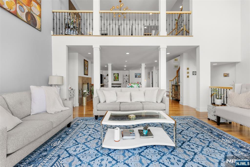 7 Oakdene Terrace, Unit 7 Edgewater, NJ 07020 - Photo 2 of 30 a living room with furniture a rug and kitchen view