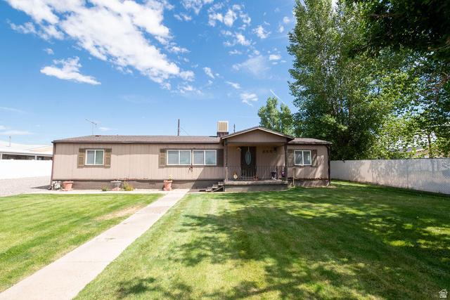 855 East 300 N Street Beaver, UT 84713 - Photo 1 of 44 Expansive front lawn with a concrete pathway to the covered entry