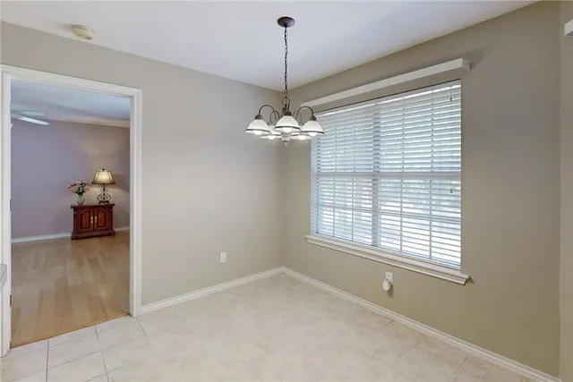 a kitchen with stainless steel appliances granite countertop a refrigerator sink and stove