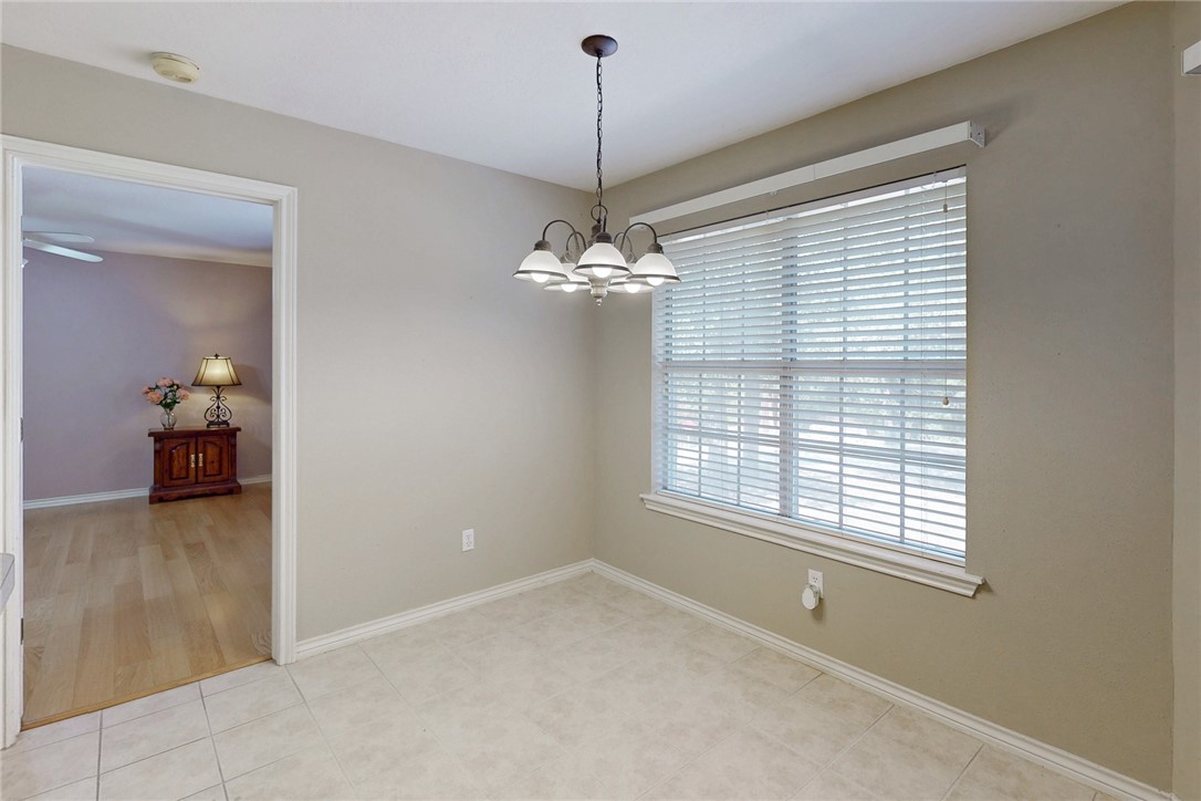 5901 Sheffield Terrace Lane Bryan, TX 77802 - Photo 11 of 31 Breakfast area open to kitchen, family room, and primary bedroom access