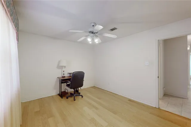 a bathroom with a shower a toilet and a sink