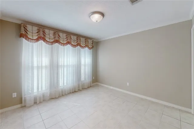 a view of an empty room with a fireplace