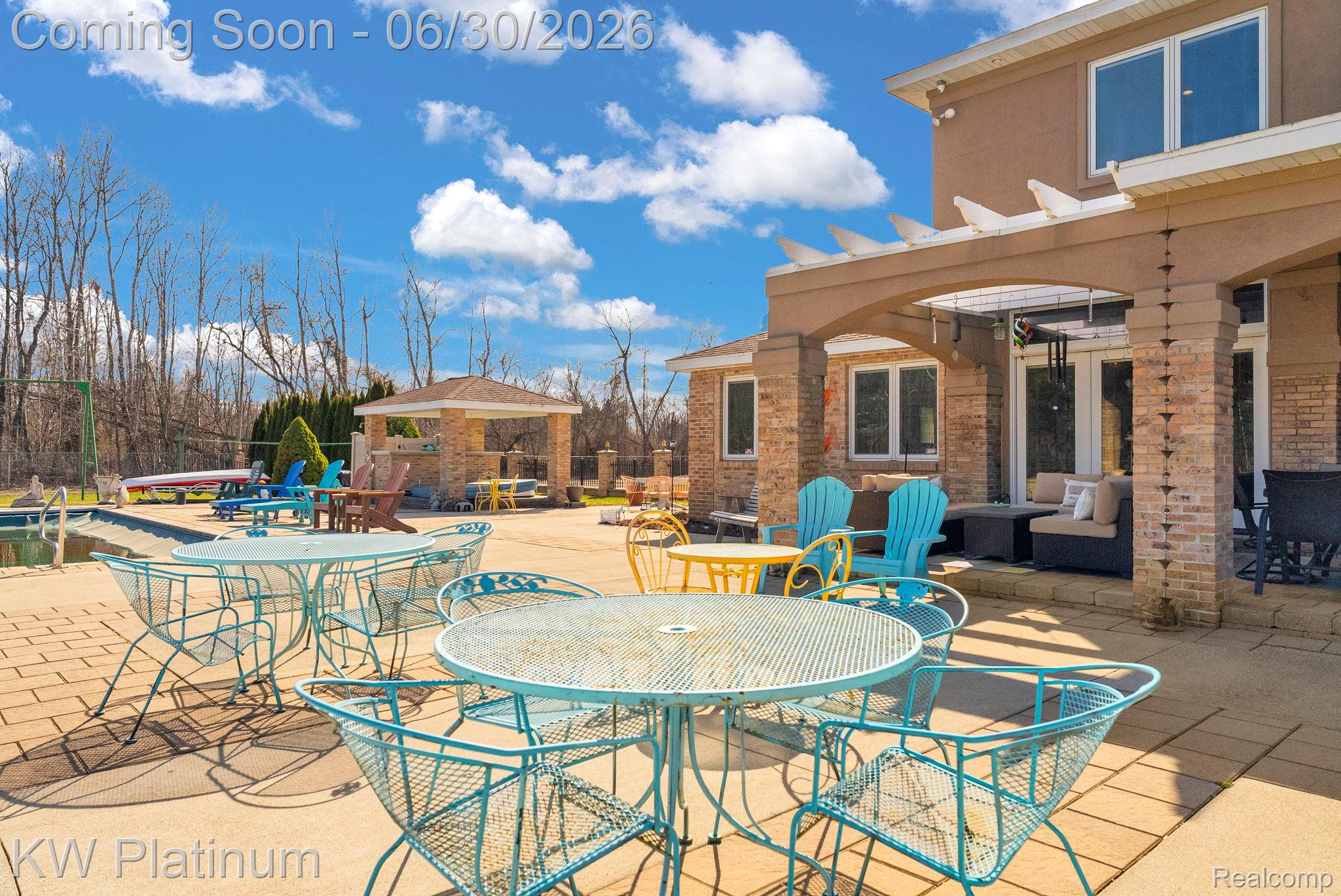 2235 South Lake Shore Road Harbor Beach, MI 48441 - Photo 52 of 99 Expansive paver patio with a pergola-covered outdoor living area