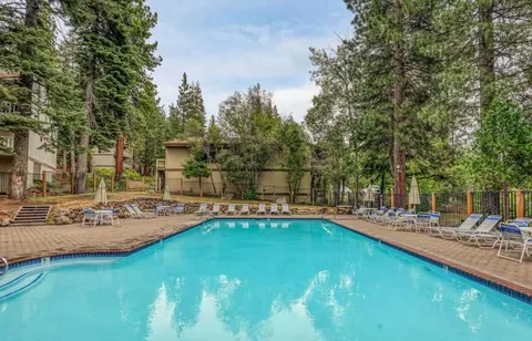 a view of a swimming pool with chairs