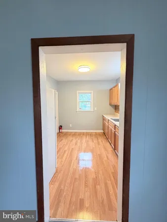 a view of a living room with a wooden floor