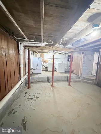 a view of empty room with wooden walls