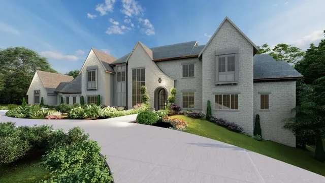 a front view of a house with a yard and potted plants