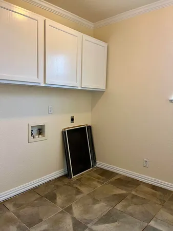 a view of cabinets and wooden floor