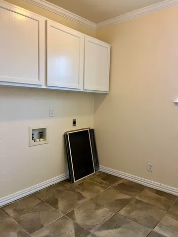 a view of cabinets and wooden floor