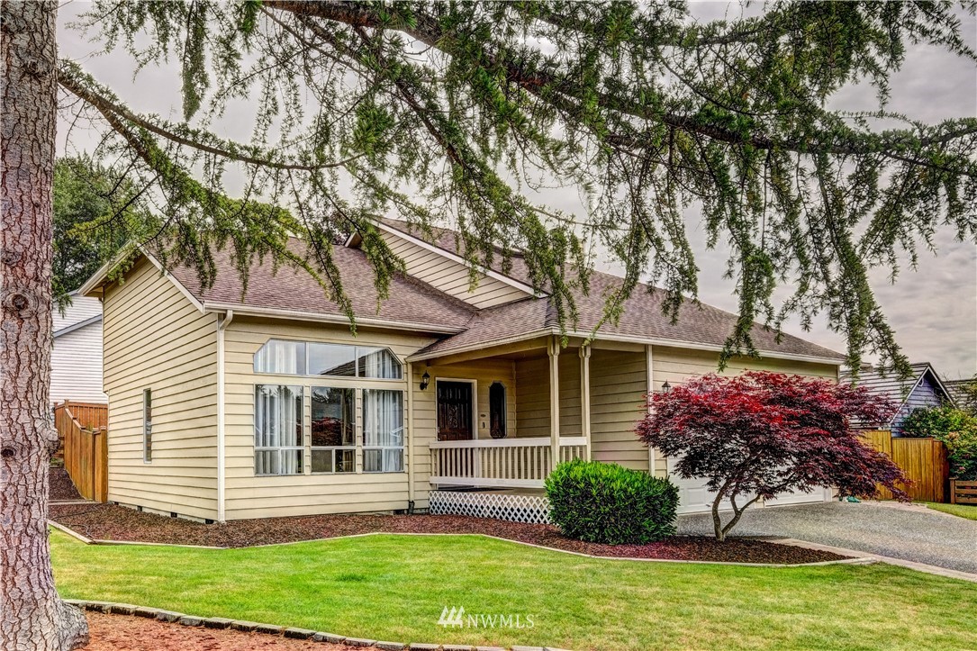 23221 13th Place West Bothell, WA 98021 - Photo 1 of 29 a front view of a house with a yard and garage