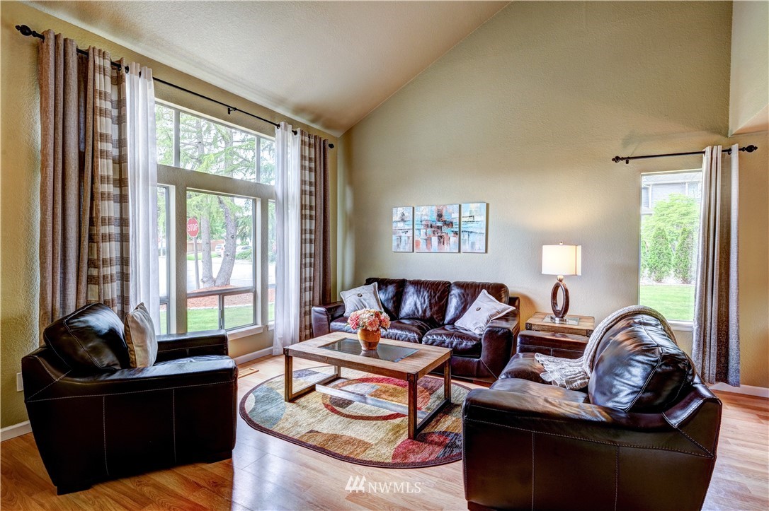 23221 13th Place West Bothell, WA 98021 - Photo 2 of 29 a living room with furniture and a large window