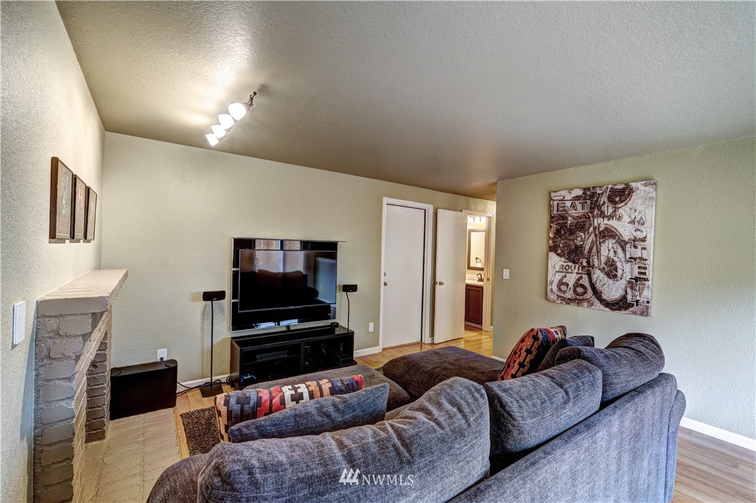 23221 13th Place West Bothell, WA 98021 - Photo 11 of 29 a living room with furniture and a flat screen tv