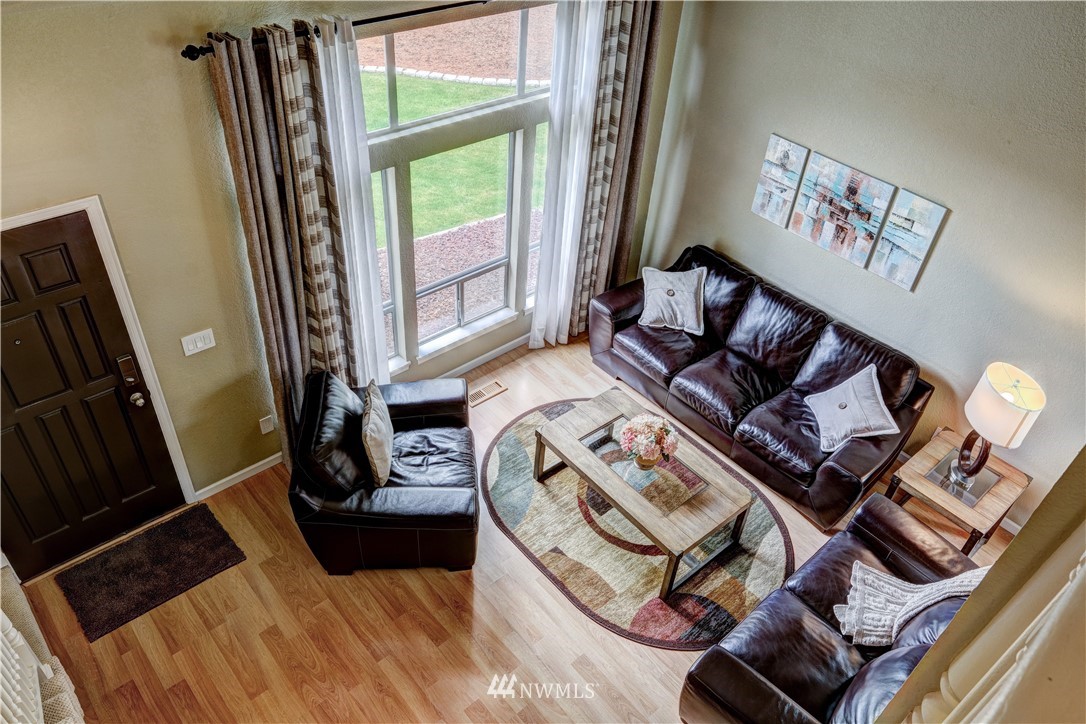 23221 13th Place West Bothell, WA 98021 - Photo 13 of 29 a living room with furniture and a large window