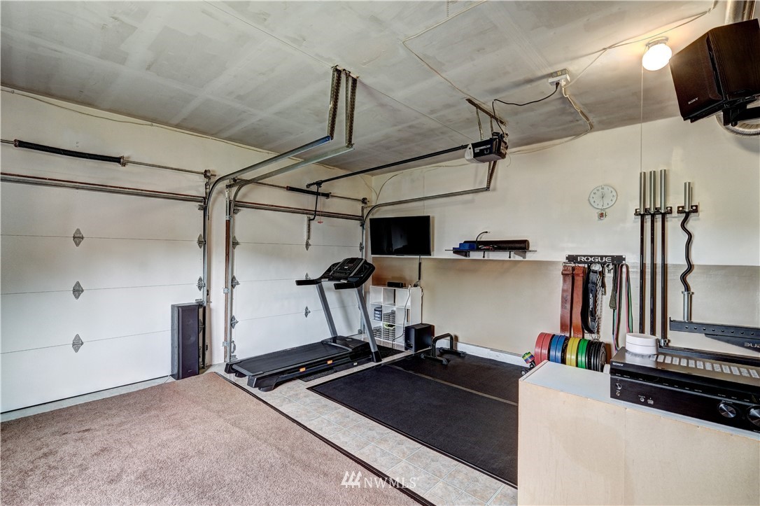 23221 13th Place West Bothell, WA 98021 - Photo 20 of 29 a room with gym equipment and wooden floor