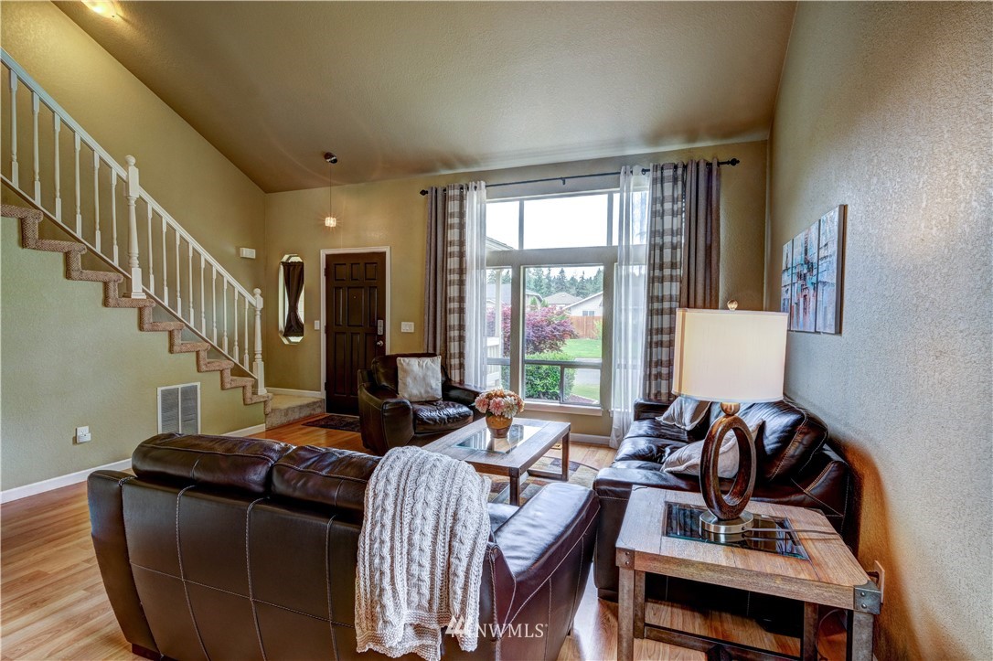 23221 13th Place West Bothell, WA 98021 - Photo 3 of 29 a living room with furniture and a window