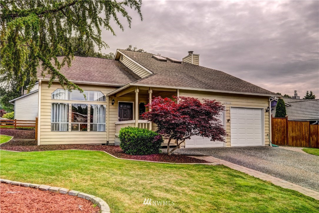 23221 13th Place West Bothell, WA 98021 - Photo 26 of 29 a front view of a house with garden