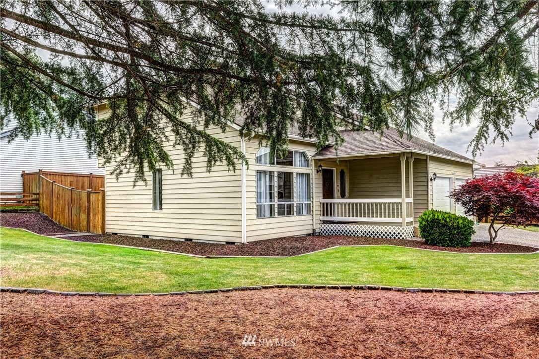 23221 13th Place West Bothell, WA 98021 - Photo 27 of 29 a front view of a house with a yard and trees