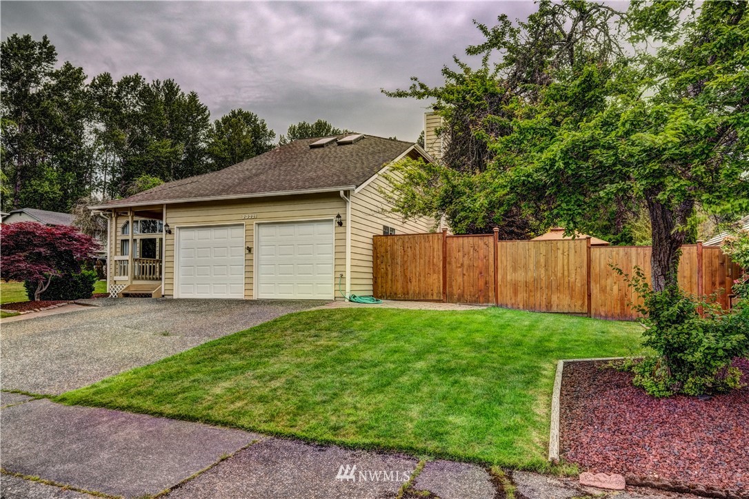 23221 13th Place West Bothell, WA 98021 - Photo 28 of 29 a view of a backyard with plants and large tree