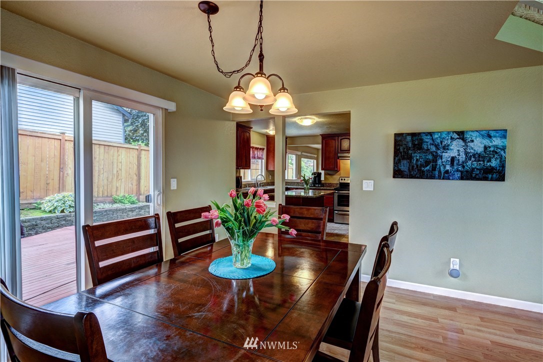23221 13th Place West Bothell, WA 98021 - Photo 5 of 29 a view of a dining room with furniture window and wooden floor