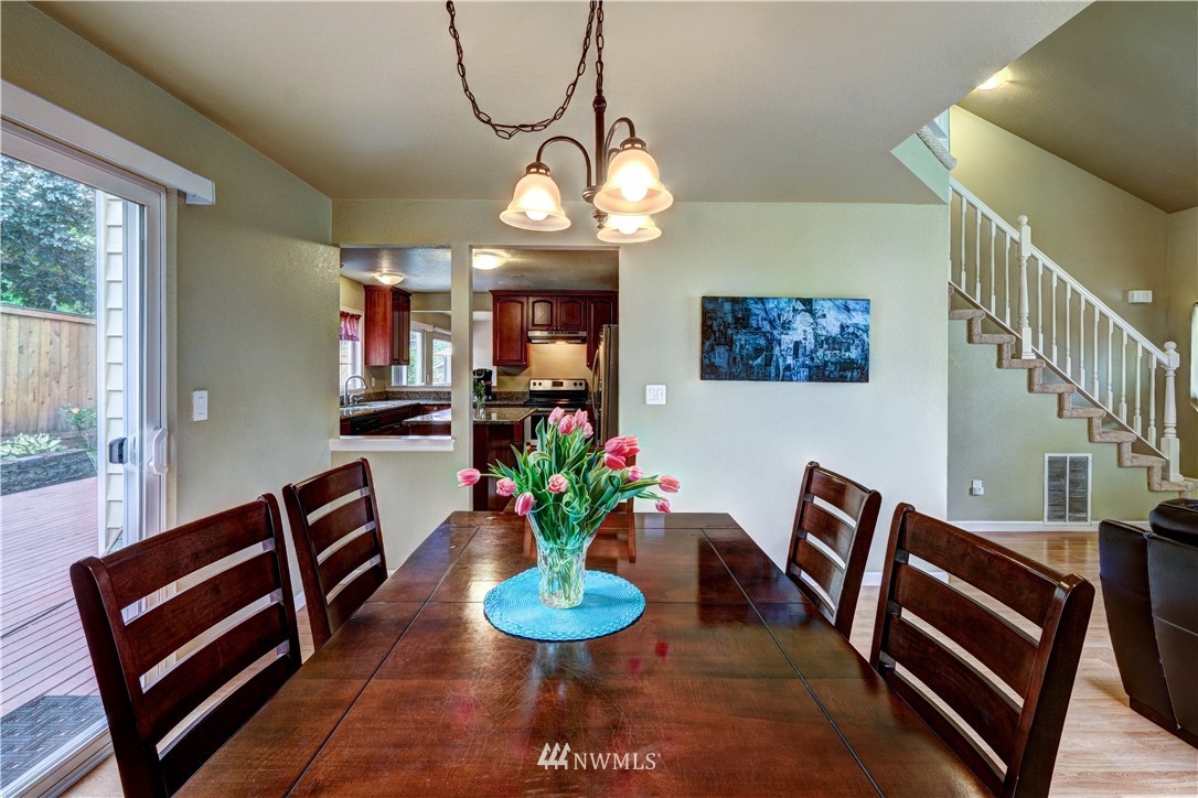 23221 13th Place West Bothell, WA 98021 - Photo 6 of 29 a view of a dining room with furniture and a chandelier