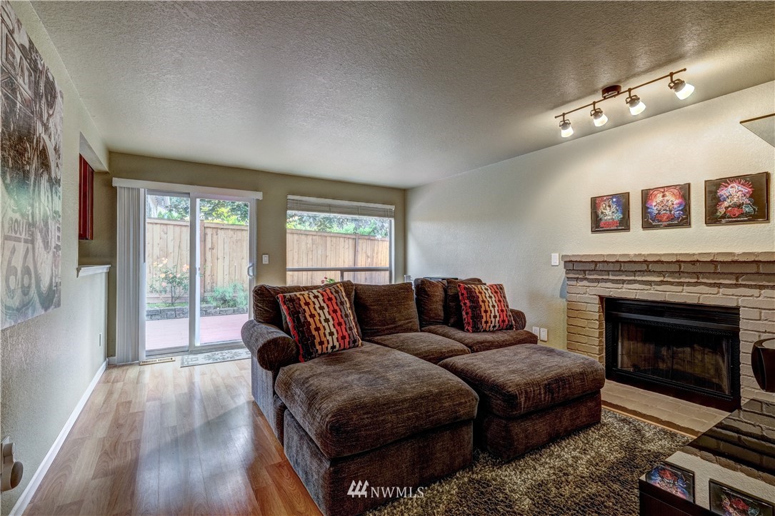 23221 13th Place West Bothell, WA 98021 - Photo 10 of 29 a living room with furniture and a fireplace