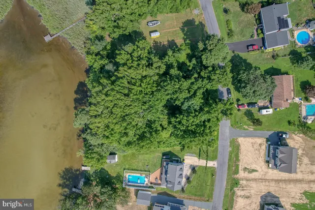 an aerial view of a house with outdoor space