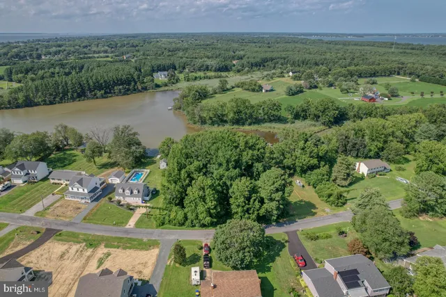 an aerial view of residential house with outdoor space and lake view