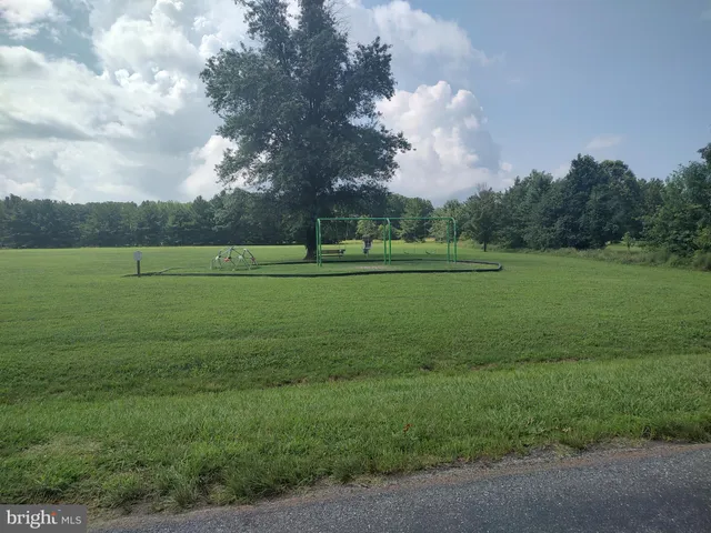 a view of a golf course with a big yard