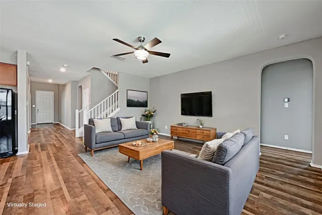 a living room with furniture and a flat screen tv