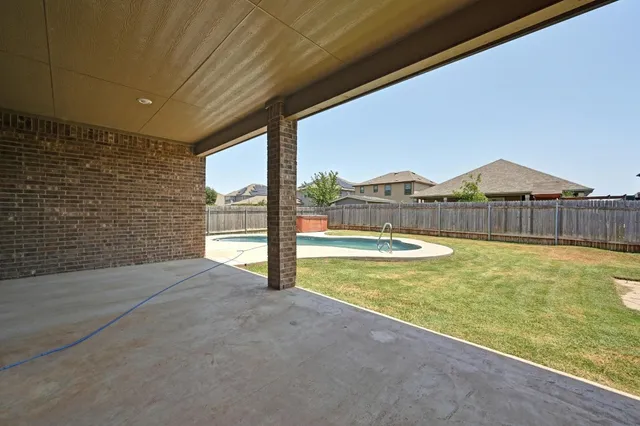 a view of a outdoor space with swimming pool