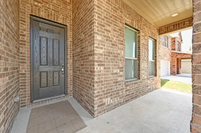 a view of front door of house with stairs
