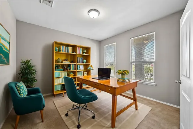 a workspace with furniture and a window