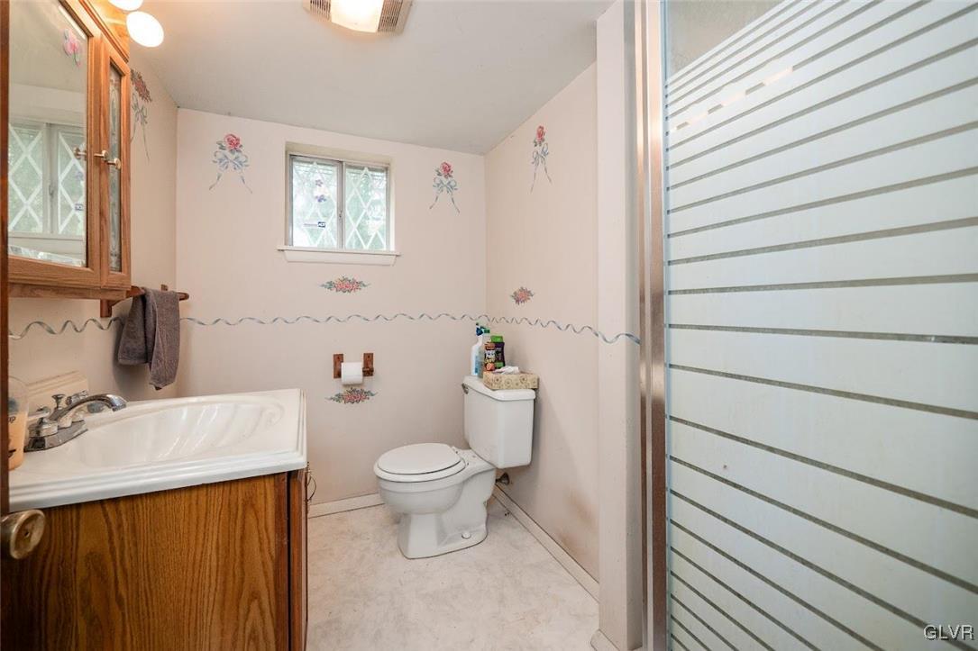 504 Heyer Mill Road Nazareth, PA 18064 - Photo 11 of 26 a bathroom with a sink a toilet and a mirror
