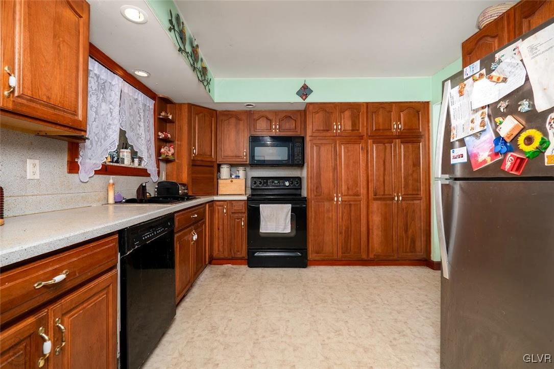 504 Heyer Mill Road Nazareth, PA 18064 - Photo 2 of 26 a kitchen with stainless steel appliances granite countertop a refrigerator and a sink