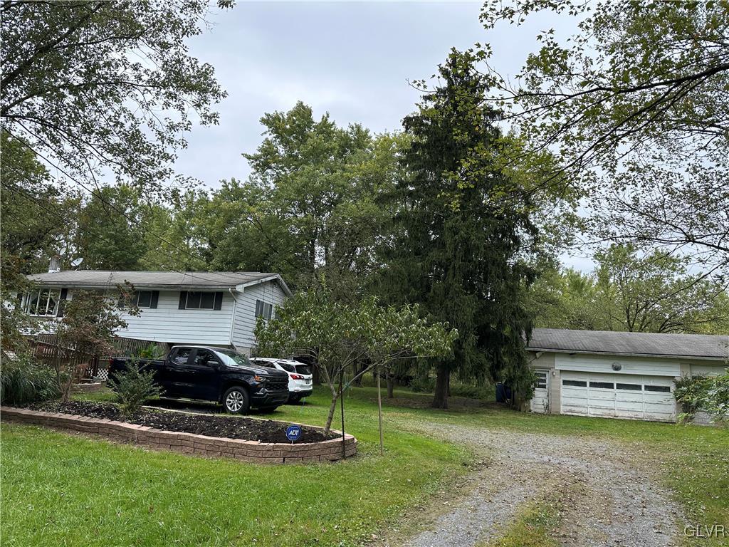 504 Heyer Mill Road Nazareth, PA 18064 - Photo 26 of 26 a view of a house with backyard sitting area and garden